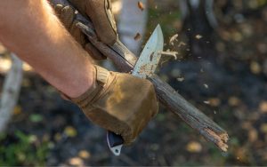 Equip a pair of gloves while using a knife