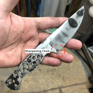 A poorly done sharpening choil cracked during re-sharpening. 